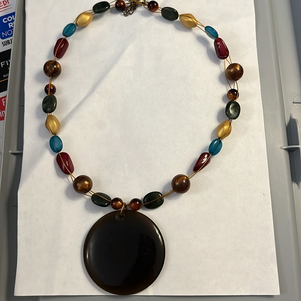 Colorful beaded necklace with pendant.